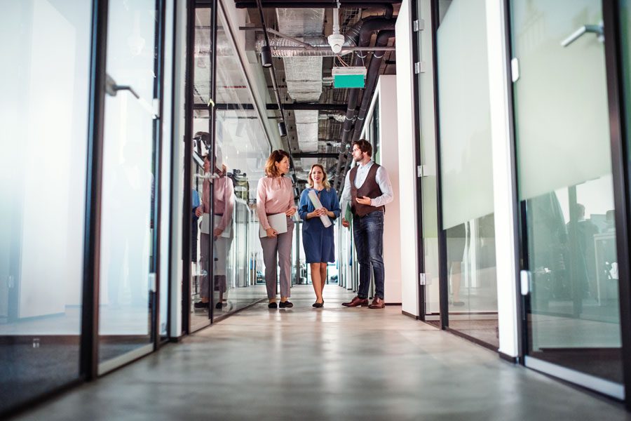 General Liability - Office Hallway of Employees Standing and Chatting